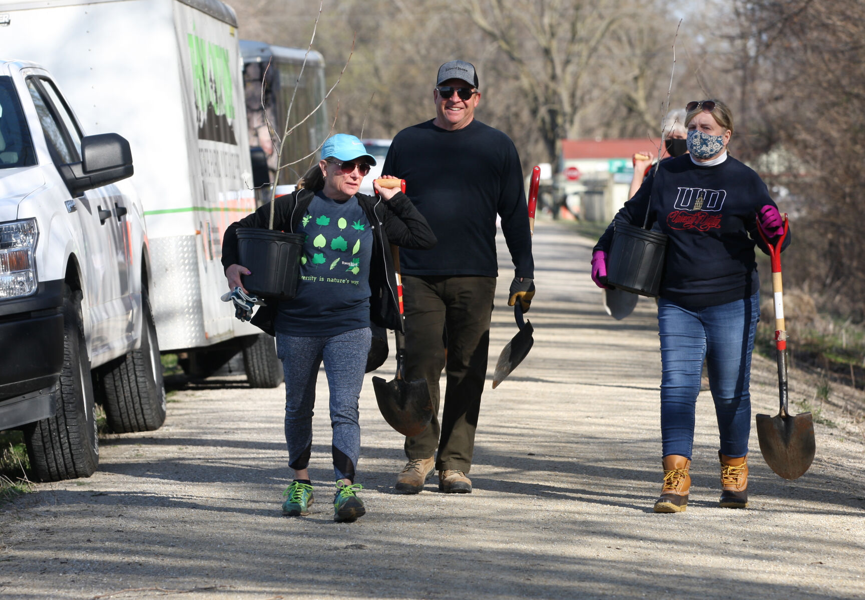 Margie Bittner, Vicki Broom and Steve Broom walk the trail